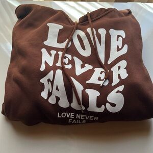 Brown drawstring hoodie love never fails graphic hoodie